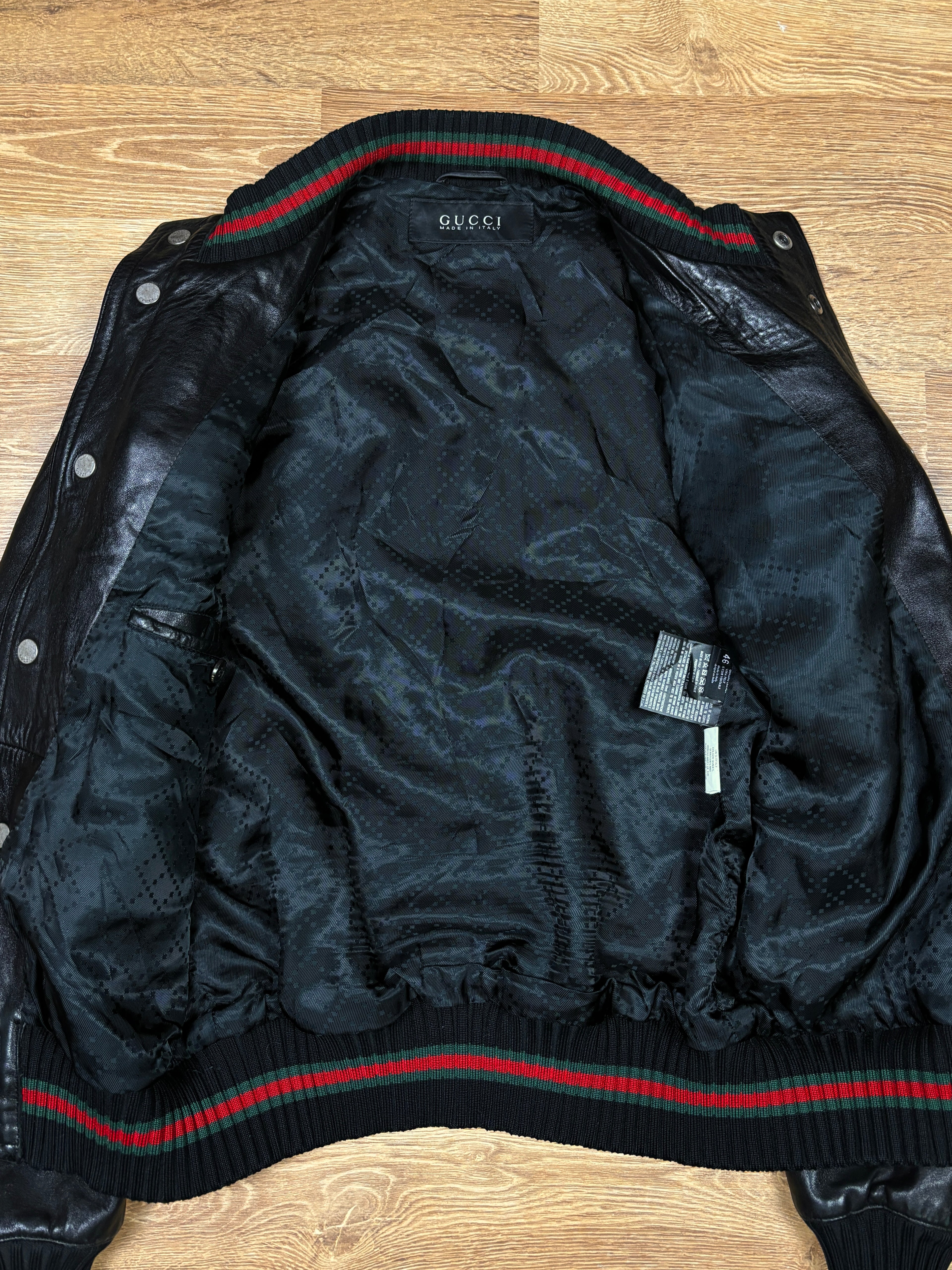 Chaqueta bomber de piel con franja web de Gucci de los 2000